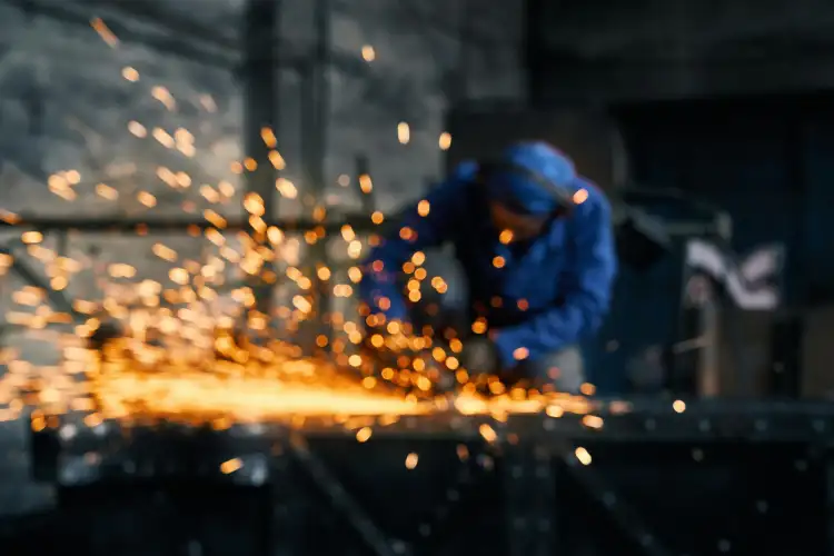 Welder working on a metal fabrication project