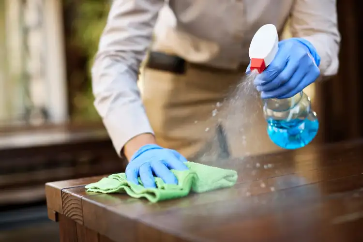 Facility management professional cleaning a commercial office