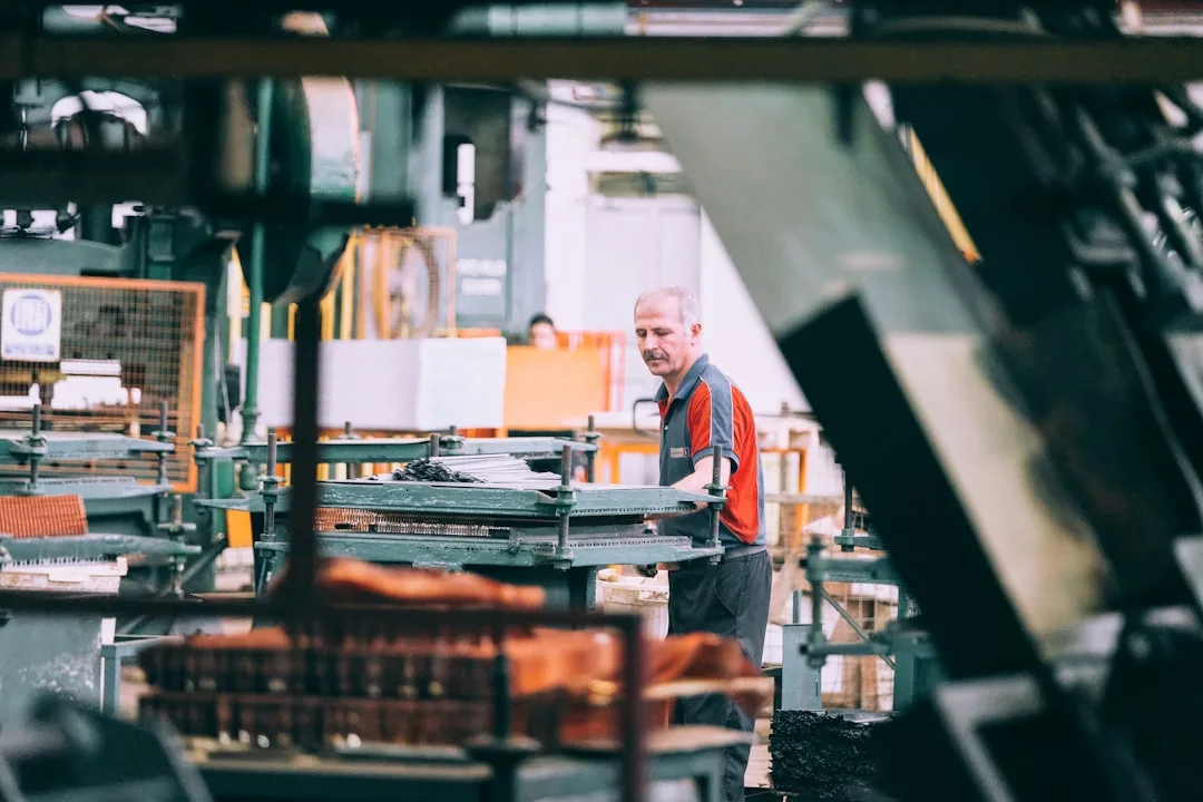Manufacturing professional operating equipment on a production line