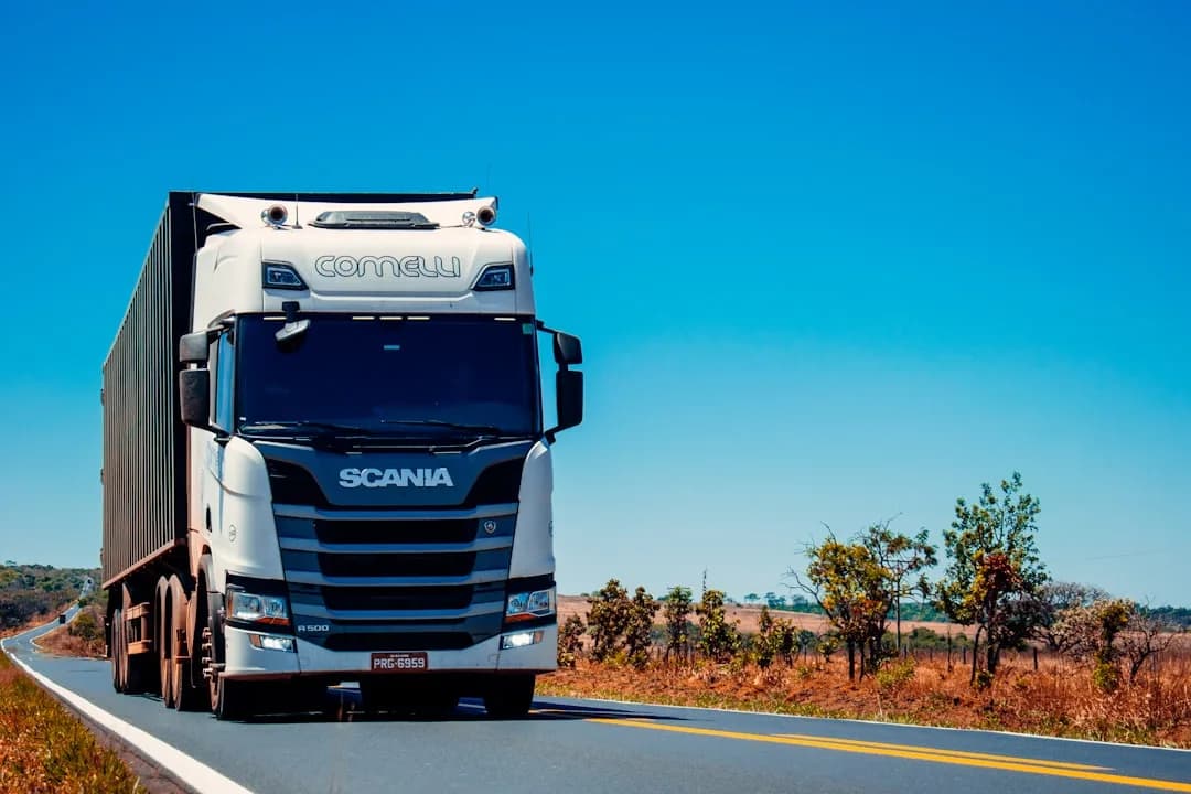 Professional driver beside a heavy goods vehicle